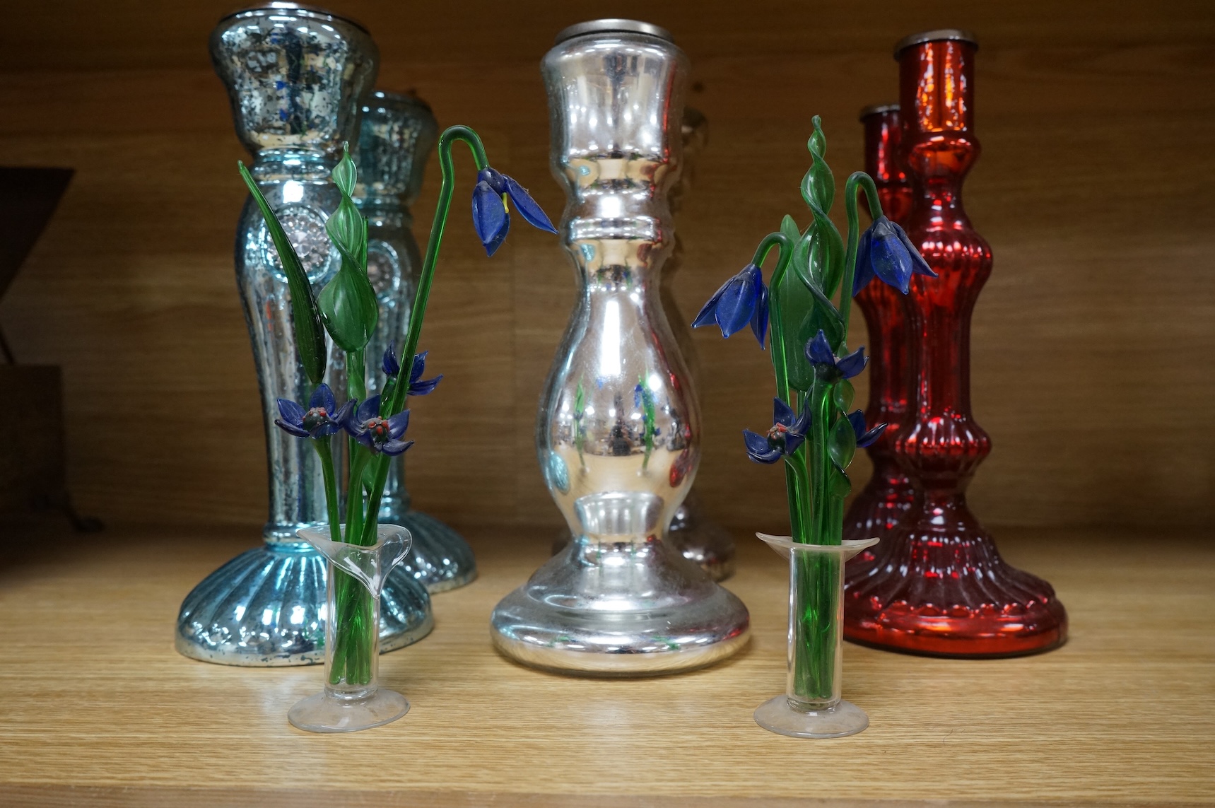 Three pairs of mirrored glass candlesticks and two small glass floral displays, largest 26cm high